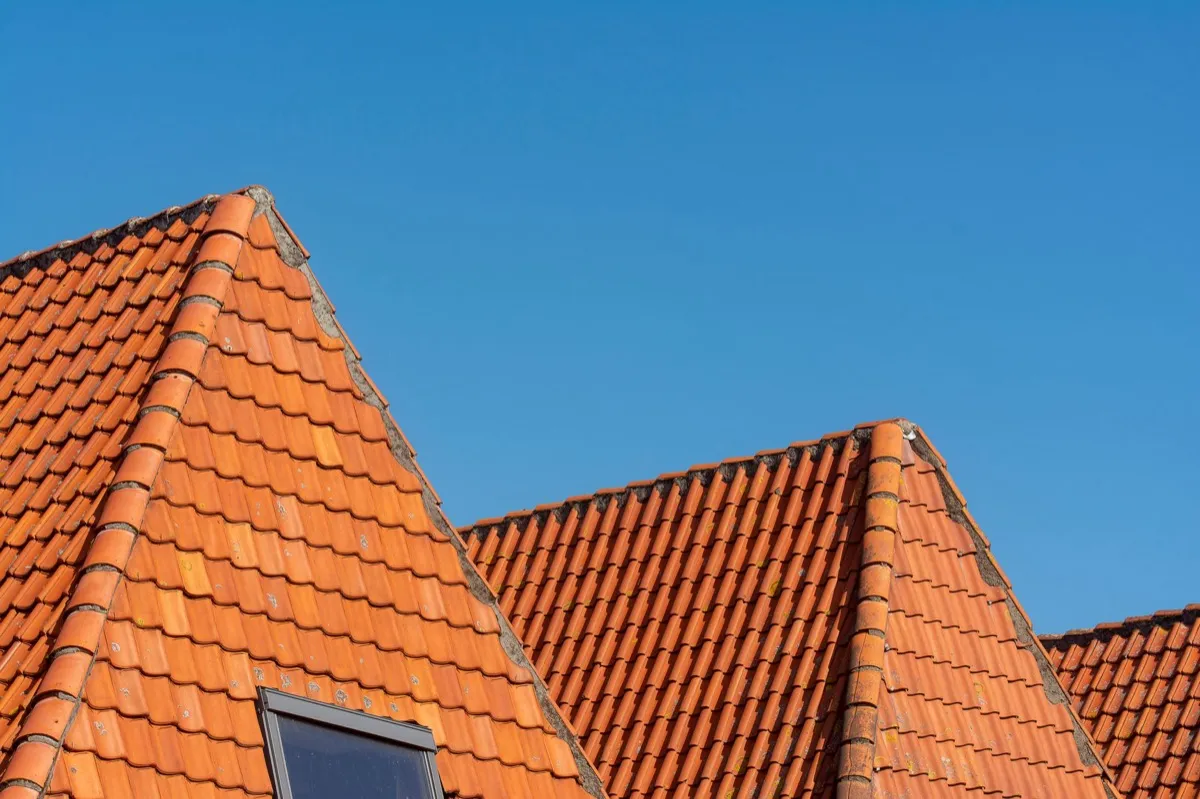 Clay barrel tile rooflines on homes in Allen, TX